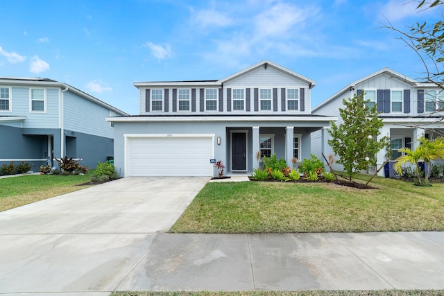 front of property featuring a garage, a front yard, and covered porch