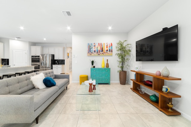 living room with light tile patterned floors