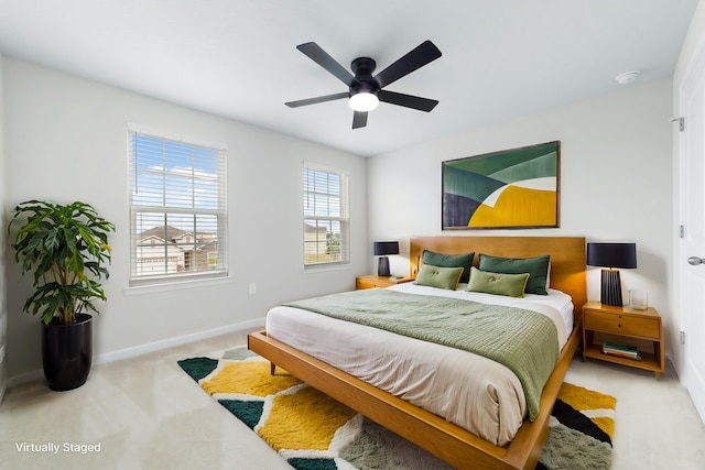 bedroom featuring ceiling fan and light colored carpet