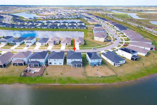 bird's eye view with a water view