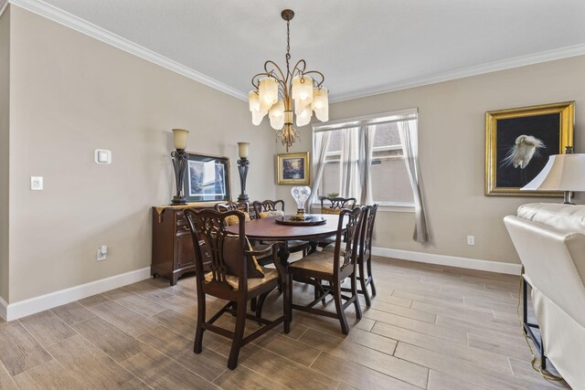 bedroom with crown molding, ensuite bathroom, ceiling fan, and a tray ceiling