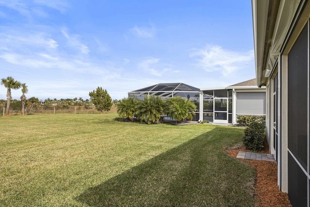 view of yard with a lanai