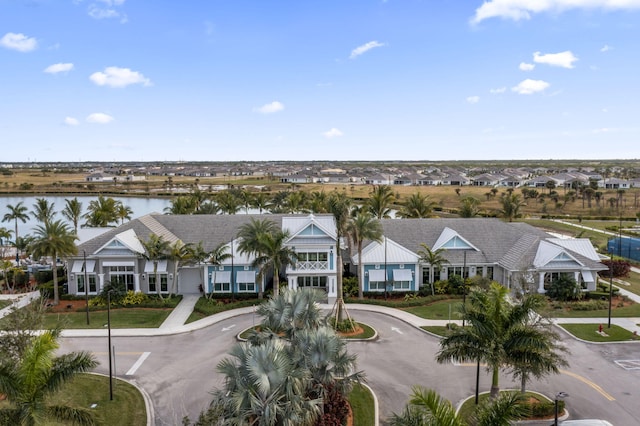 birds eye view of property with a water view