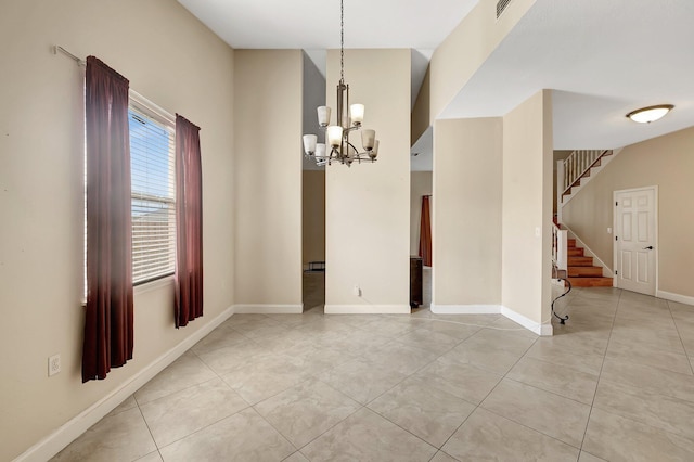 unfurnished dining area featuring light tile patterned floors and a chandelier