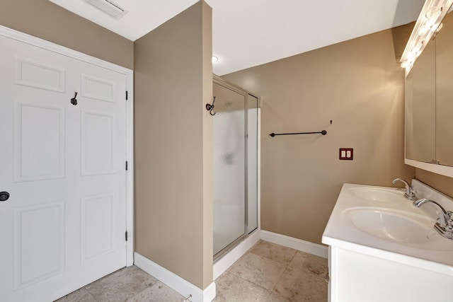 bathroom with vanity, tile patterned flooring, and a shower with door