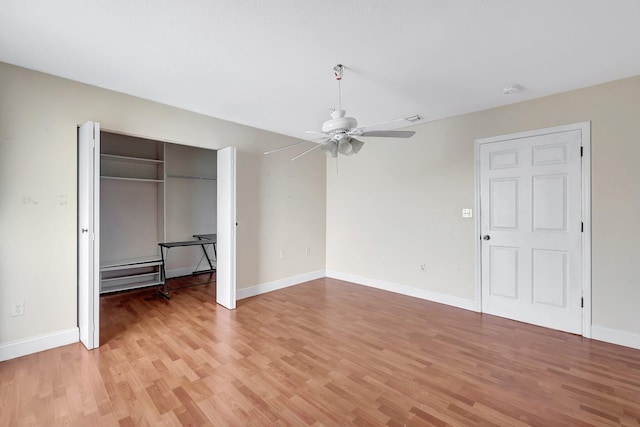 unfurnished bedroom with light hardwood / wood-style floors, a closet, and ceiling fan