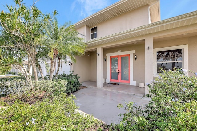 property entrance with french doors and a patio area