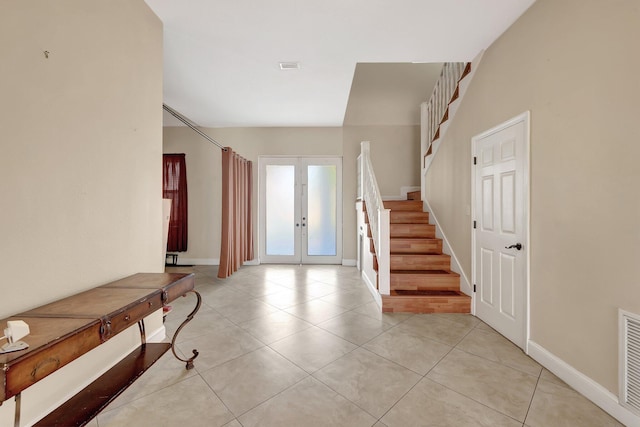 tiled foyer with french doors