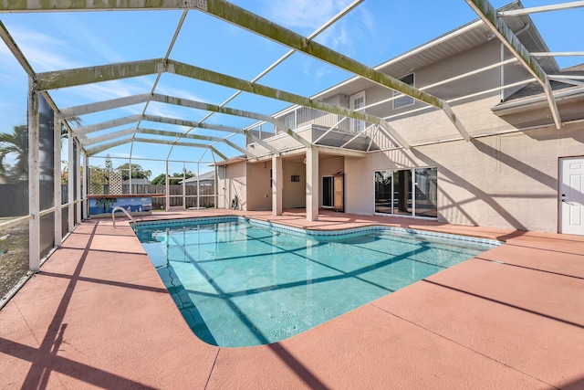 view of pool featuring a patio, a jacuzzi, and glass enclosure