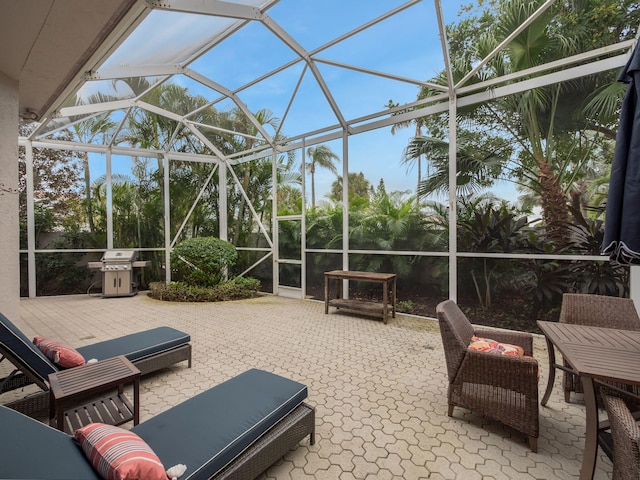 view of patio / terrace with a lanai and area for grilling