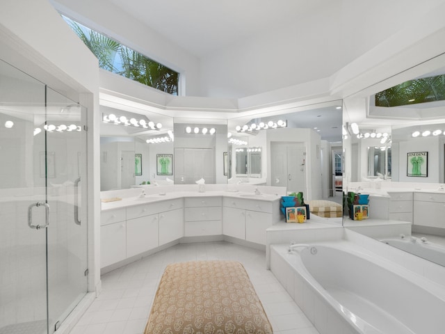 bathroom featuring a high ceiling, vanity, separate shower and tub, and tile patterned floors