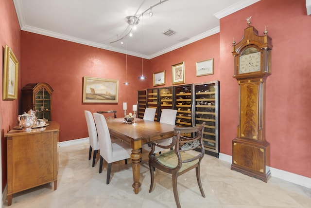 dining space with crown molding and beverage cooler