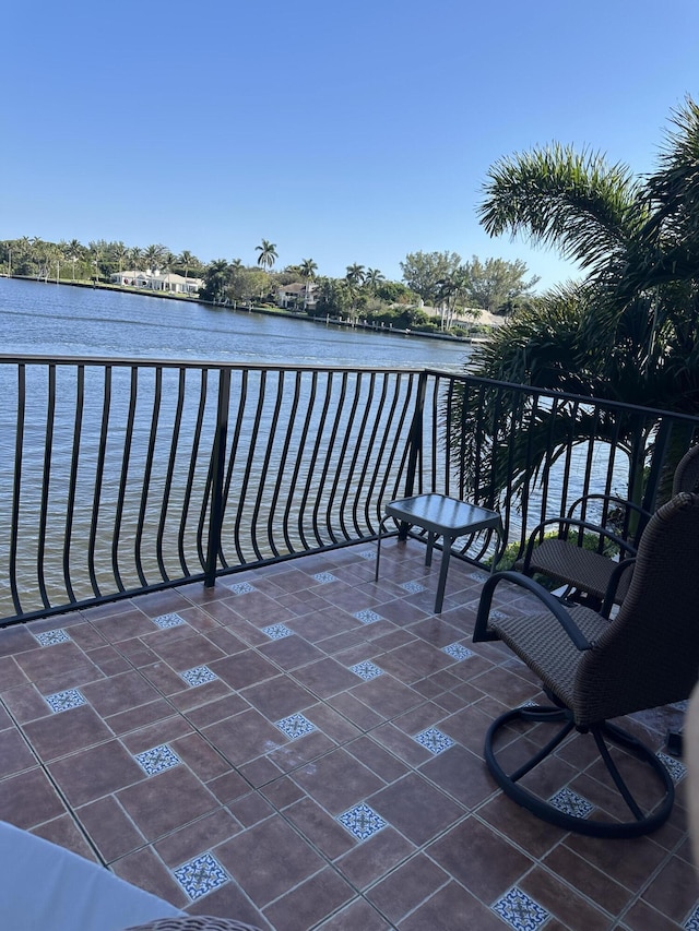 balcony featuring a water view