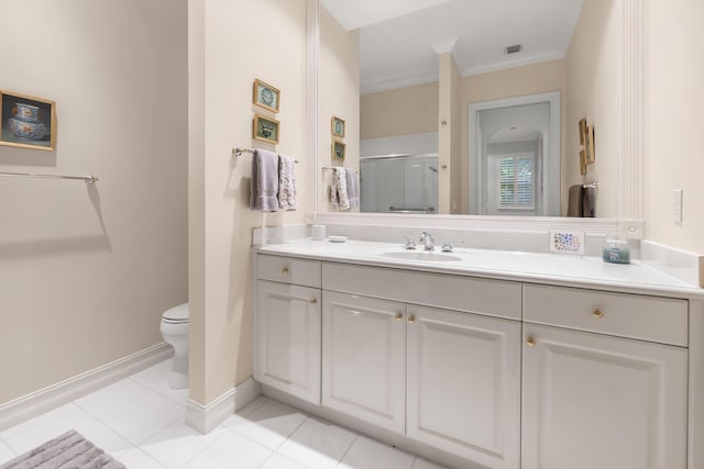 bathroom with a shower with shower door, vanity, toilet, crown molding, and tile patterned floors