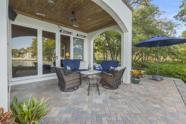 view of patio / terrace with an outdoor hangout area, ceiling fan, and french doors