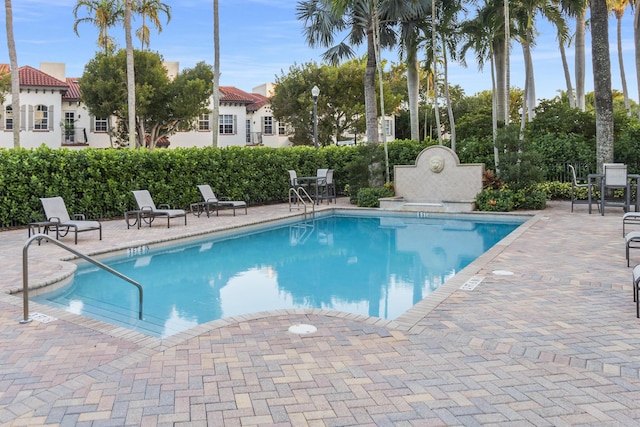 view of swimming pool with a patio area