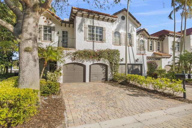 mediterranean / spanish-style house featuring a garage