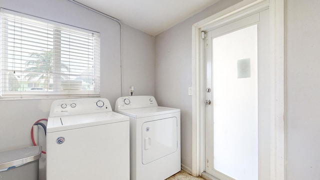 washroom featuring washing machine and dryer and laundry area