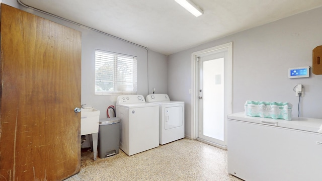 washroom featuring sink and washing machine and clothes dryer