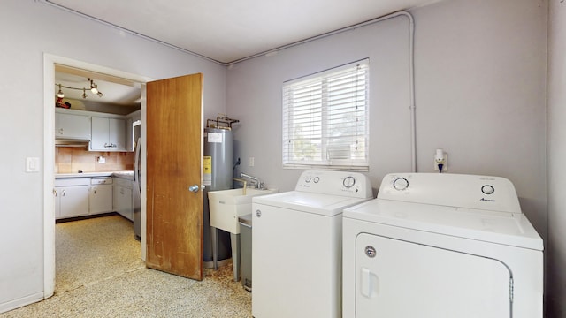 clothes washing area with washer and clothes dryer