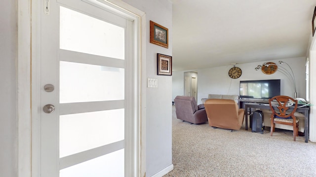 hall with speckled floor