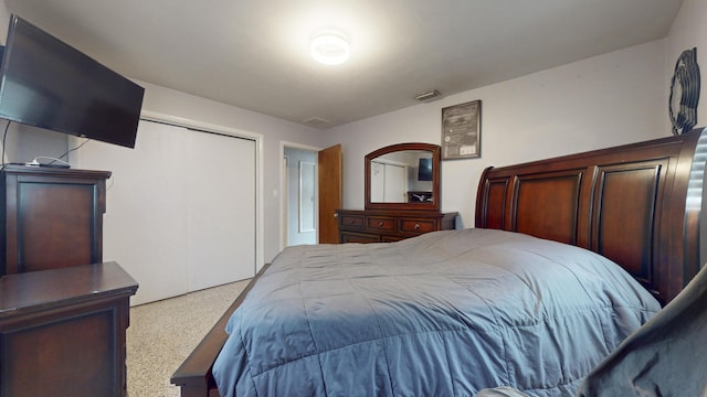 bedroom with carpet floors and a closet