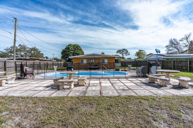 view of pool featuring a fenced backyard, a patio, and a fenced in pool