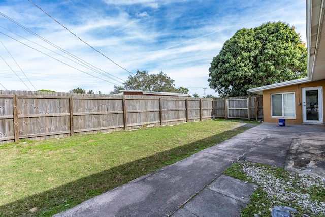 view of yard featuring a fenced backyard and a patio