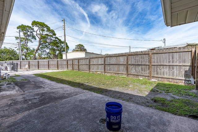 view of yard featuring a fenced backyard and a patio