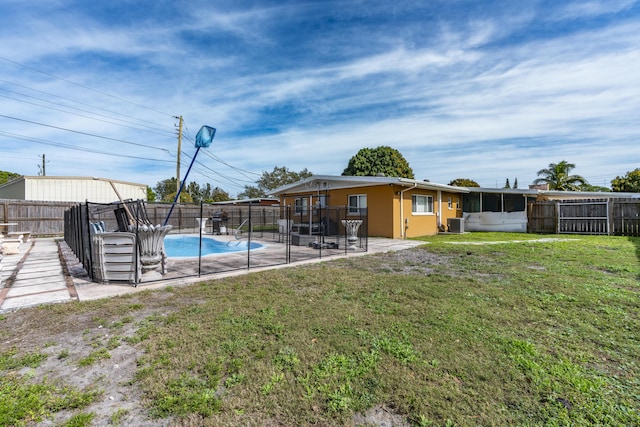 view of yard with a fenced in pool, a patio area, and central air condition unit