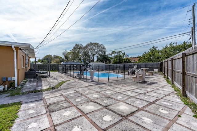 view of swimming pool with a patio