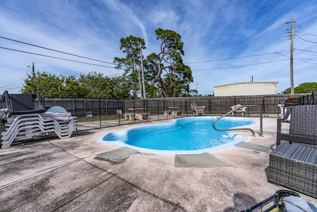 view of pool featuring a patio area