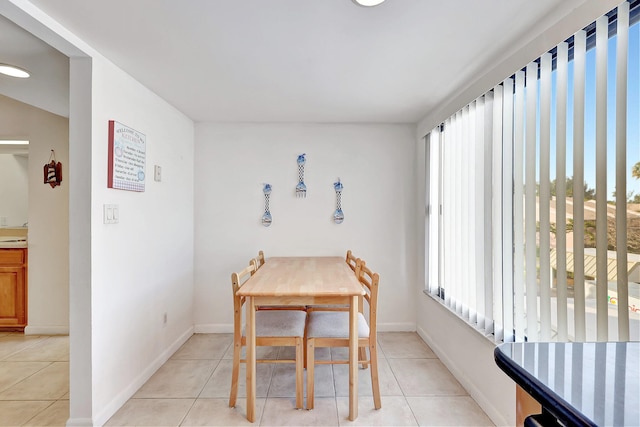 dining room with plenty of natural light and light tile patterned floors