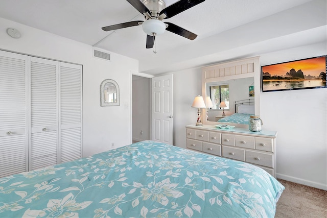 bedroom with ceiling fan, a closet, and carpet