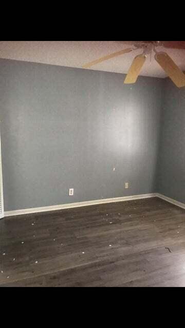 spare room featuring dark hardwood / wood-style floors