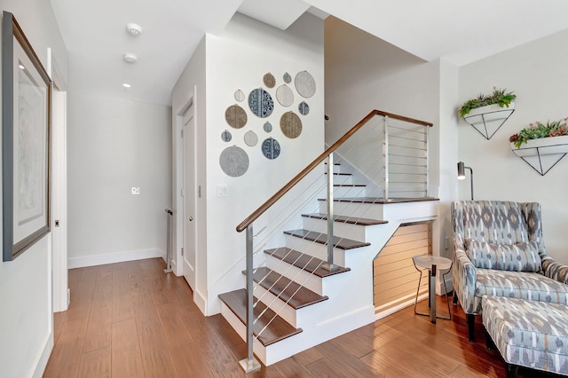 staircase featuring hardwood / wood-style flooring