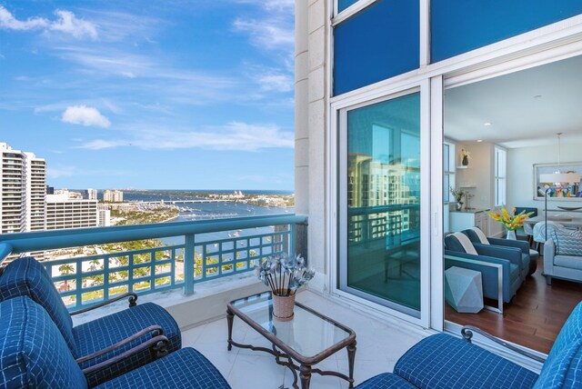 balcony featuring a water view