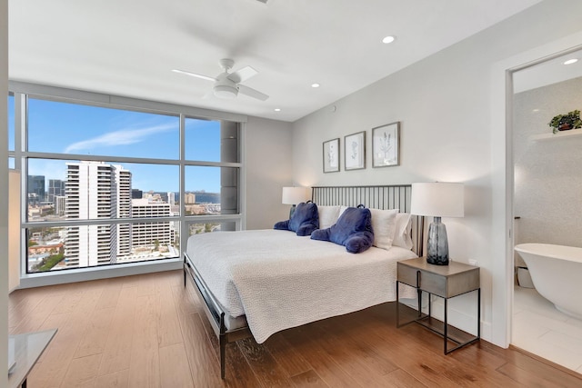 bedroom featuring hardwood / wood-style flooring and ceiling fan