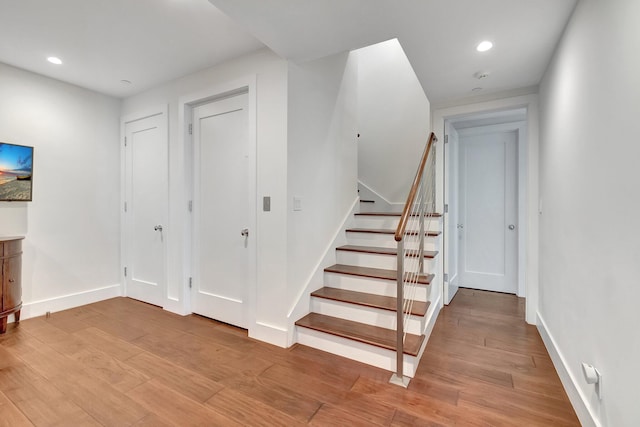 staircase featuring hardwood / wood-style floors