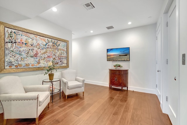 living area featuring hardwood / wood-style floors