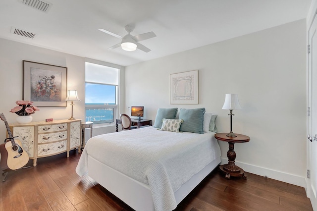 bedroom with dark wood-type flooring and ceiling fan