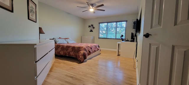 bedroom featuring light hardwood / wood-style floors and ceiling fan