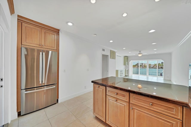 kitchen featuring recessed lighting, a ceiling fan, light tile patterned flooring, stainless steel fridge, and baseboards