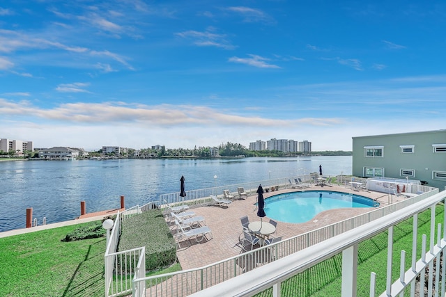 exterior space featuring a water view, a patio area, and fence