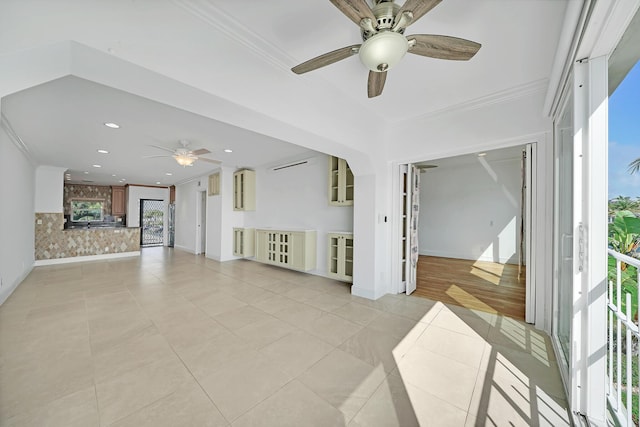 unfurnished living room with light tile patterned floors, baseboards, crown molding, and recessed lighting