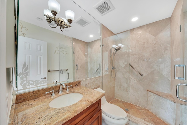 full bathroom with visible vents, toilet, a stall shower, vanity, and a chandelier