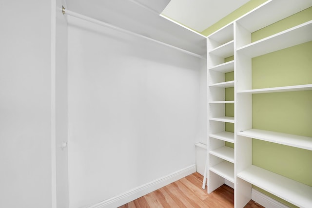 spacious closet with wood finished floors