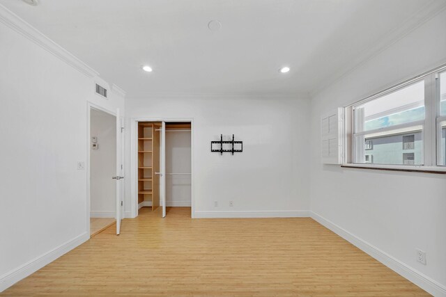 laundry area with light tile patterned floors, laundry area, and stacked washing maching and dryer