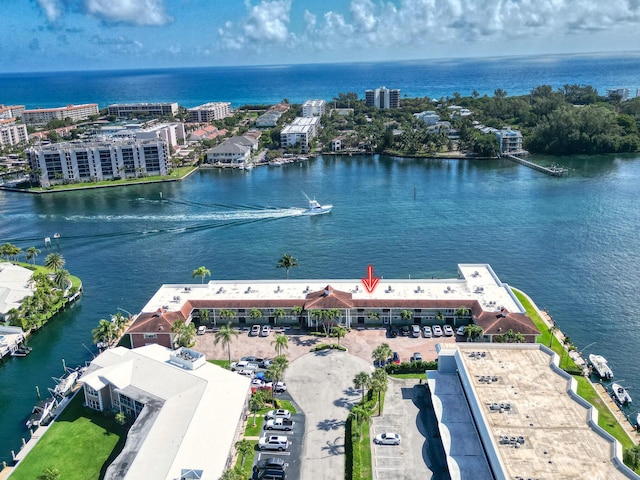 birds eye view of property with a water view