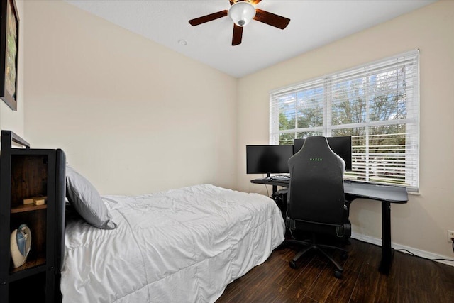 bedroom featuring dark wood-type flooring and ceiling fan